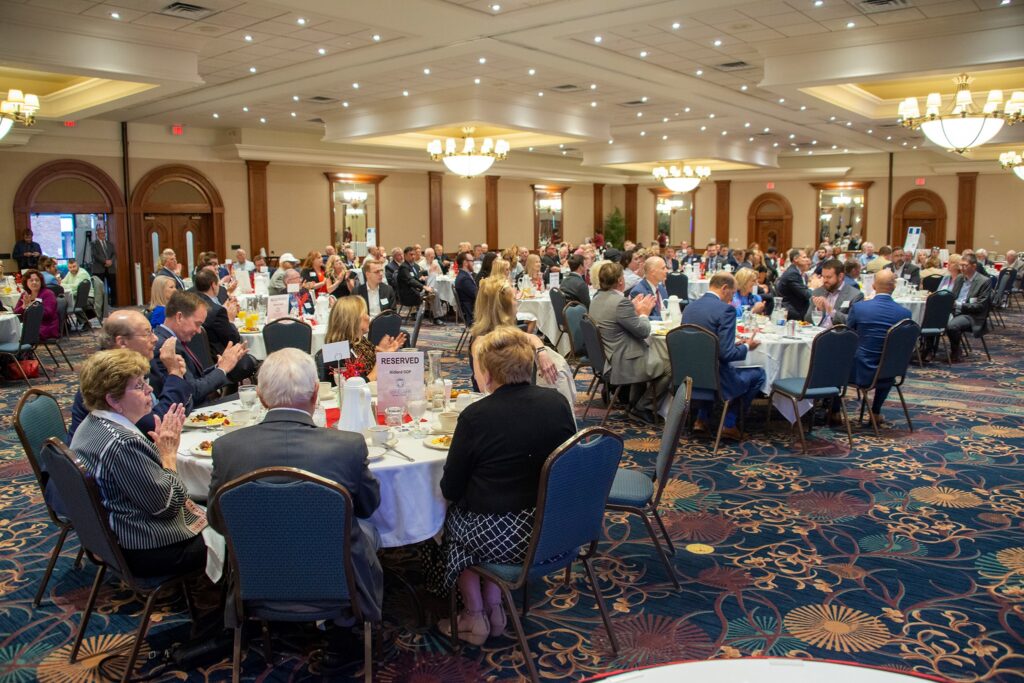 People dining at a large banquet event.