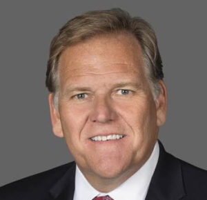 Professional man smiling in a suit.